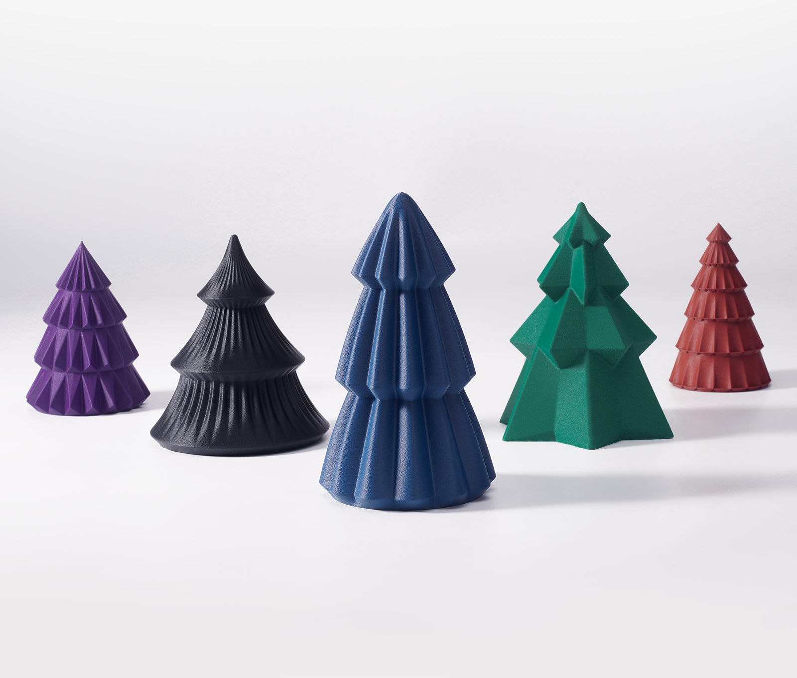 plusieurs modèles de sapins imprimés avec les filaments PETG CG Bambu Lab